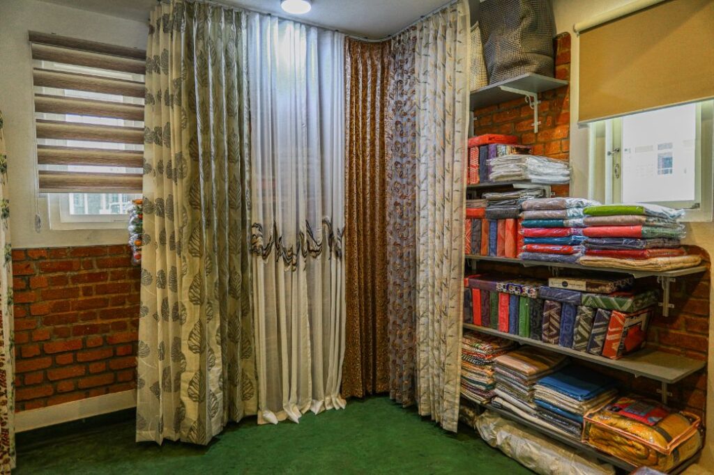 Inside the Curtain Concepts showroom, with curtain samples and fabric books