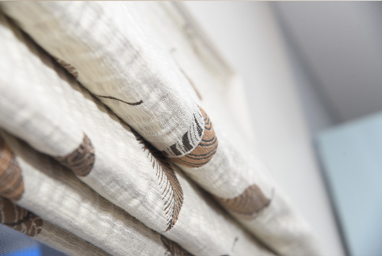 Close-up of printed linen Roman blind folds