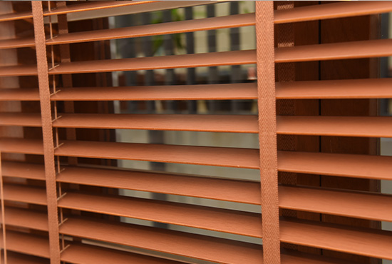 Wooden blinds tilted half open