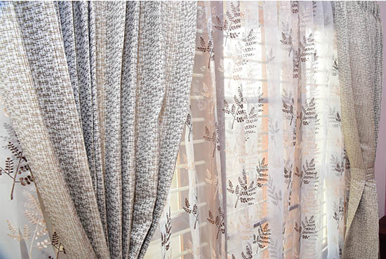 Semi-blackout curtains in a master bedroom