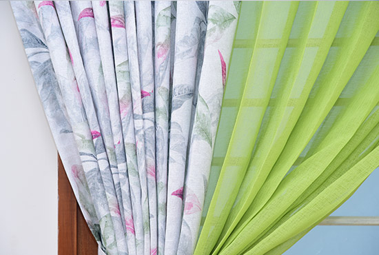 Green and floral curtains with tie-backs