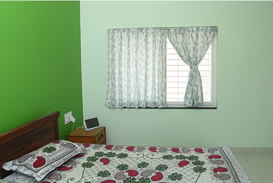Soft-hued curtains covering a full doorway